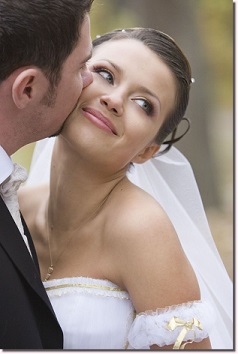 Groom kissing bride